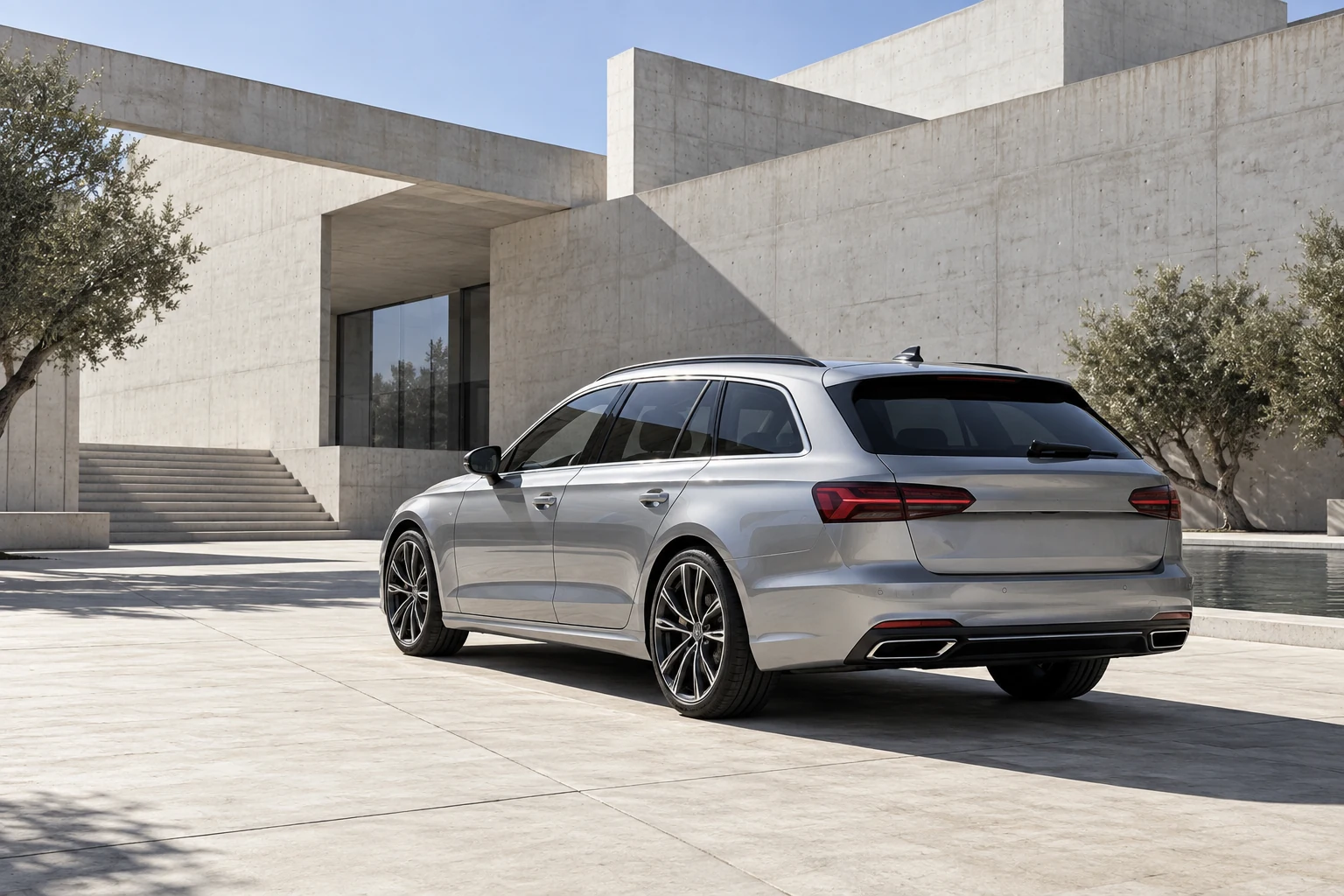 Silver estate car in a bright European architectural courtyard